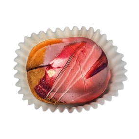 Colorful chocolate truffle in a white paper cup on a white background